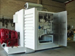 Acoustical enclosure with louvered door and reactive muffler discharge
