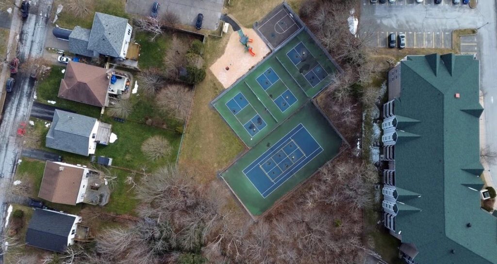Arial View Of Pickleball and Tennis Courts near residences